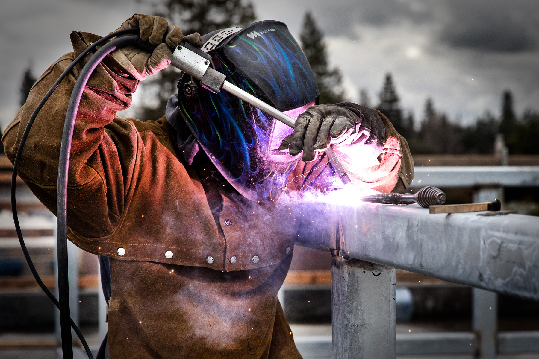 Welder on construction worksite in the San Francisco Bay Area. Photo by Chris Constantine.