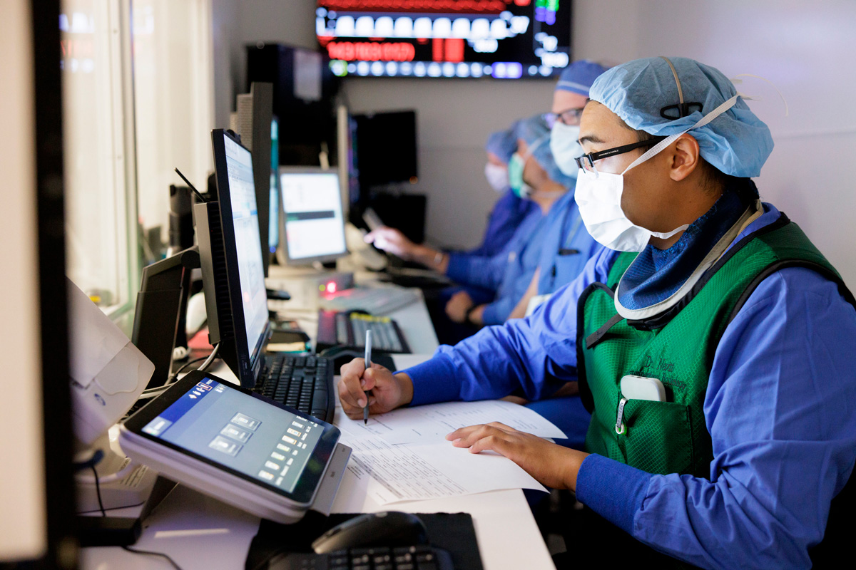 Medical professionals tend to hospital operating room photos