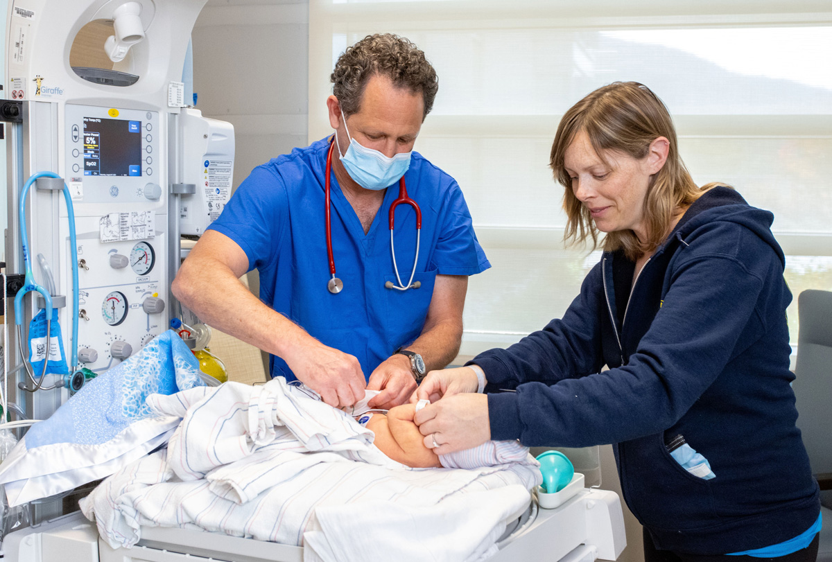 Pediatrician cares for newborn infant in hospital professional photography