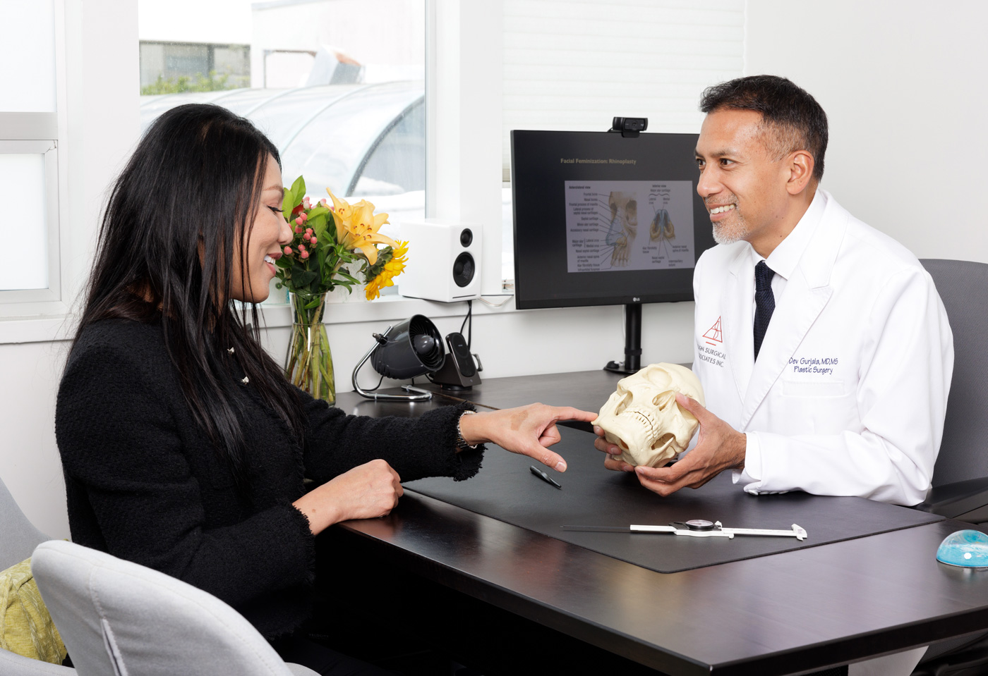 doctor meets with healthcare patient in private surgery practice